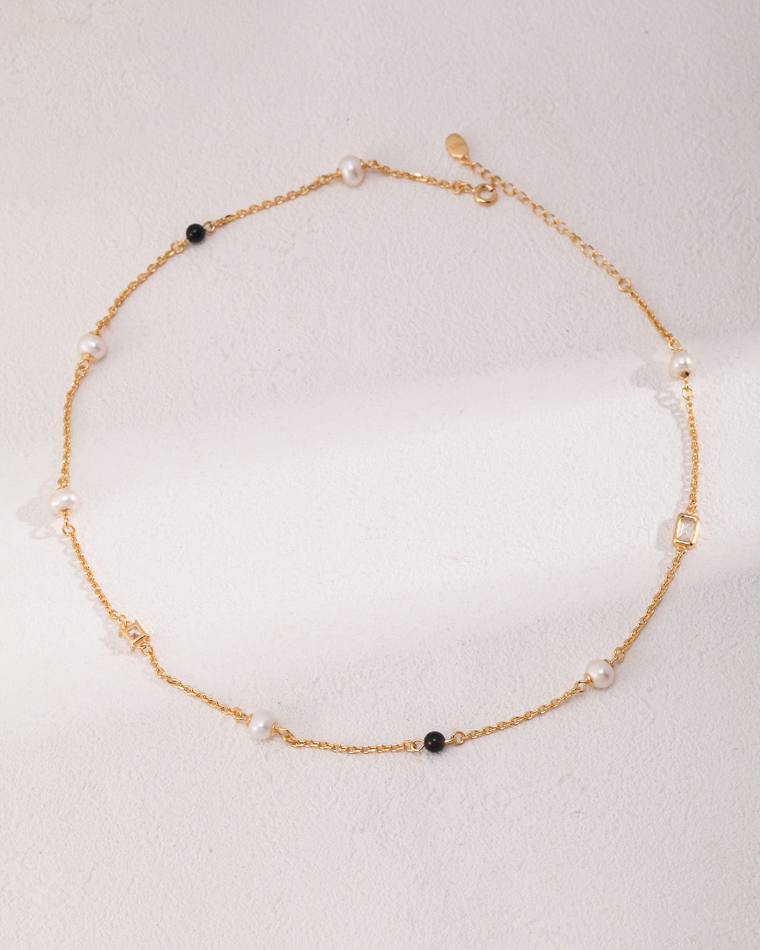 Gold Pearl Necklace in Black Onyx