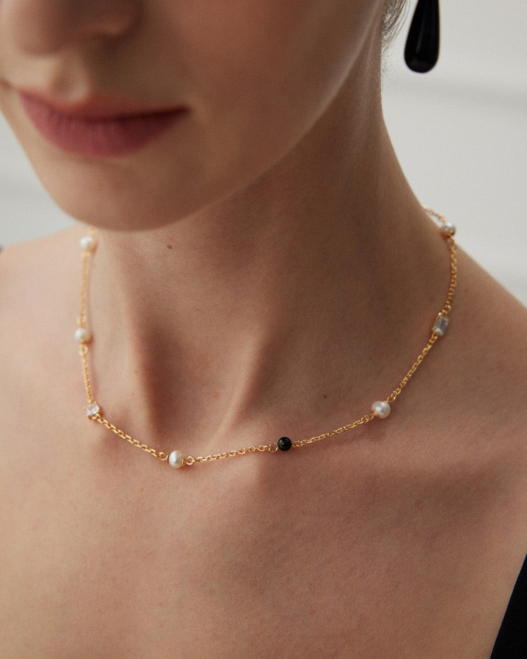 Gold Pearl Necklace in Black Onyx