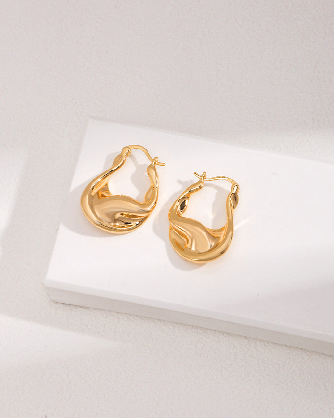 Twisted Huggie Hoop Earrings in Gold