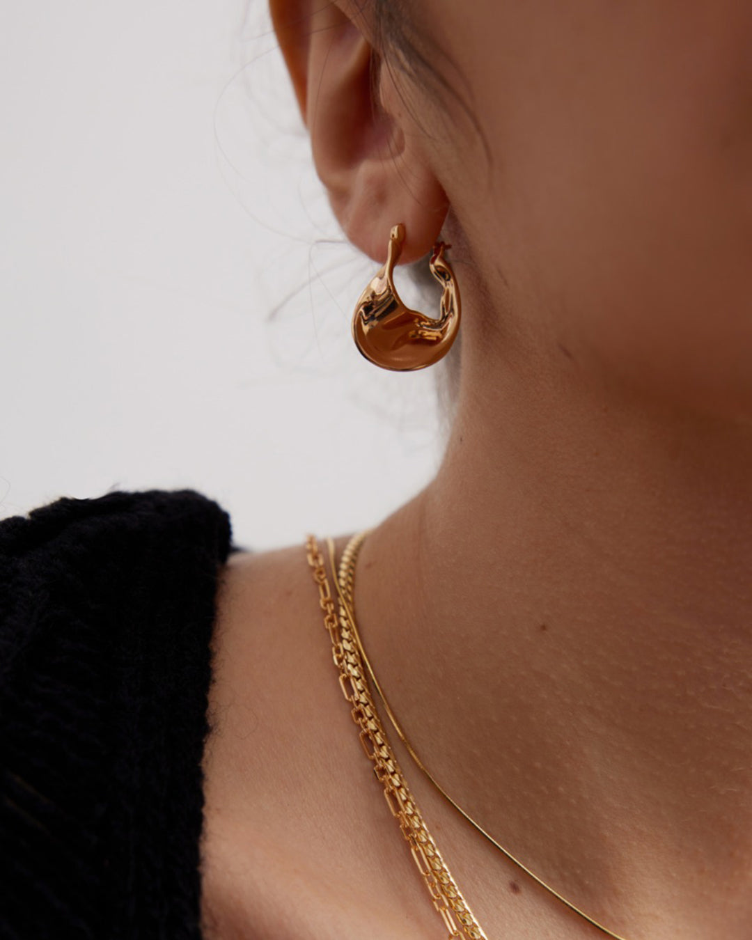 Twisted Huggie Hoop Earrings in Gold